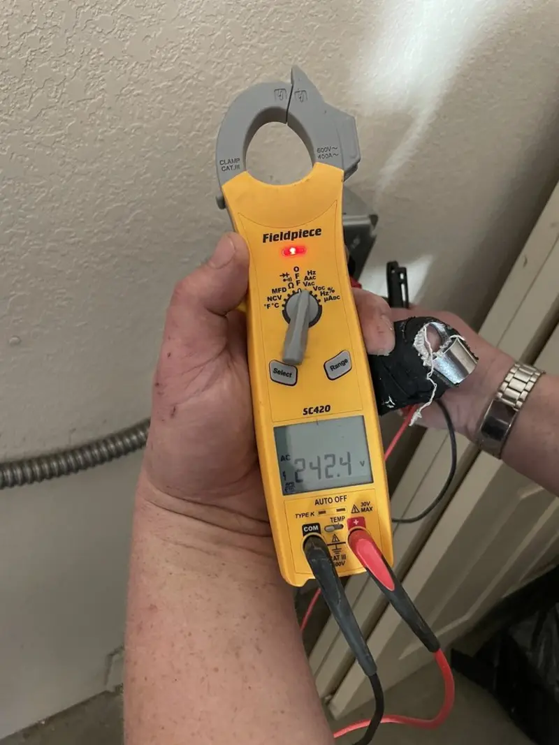 Voltage testing with clamp meter during Recessed Lighting Installation in Kewanee